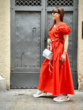 top donna arancio con fiocchi laterali