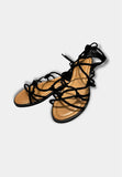 SANDALI DONNA FLAT INTRECCIATO ALLA SCHIAVA IN CAMOSCIO NERO - Shopaland